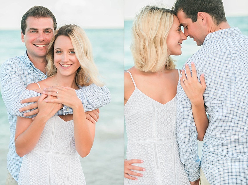 Guy with his hands wrapped around a girl on the beach