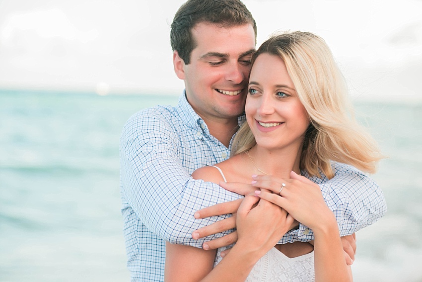 Fiance looking at his girlfriend on the beach